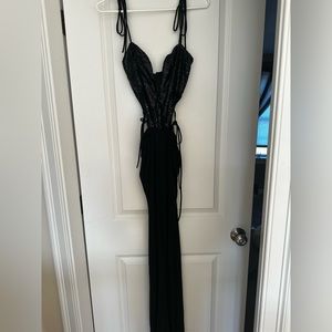 Lucy in the sky. Cutout black sequin jump suit.
